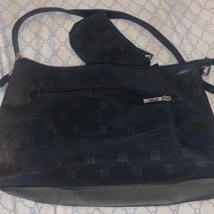 Black purse with side coin purse installed in it